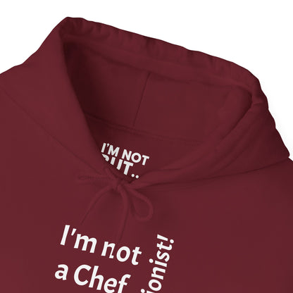 "I'm Not a Chef, But a Nutritionist!"  - Sweatshirt Unissexo Heavy Blend™ com Capuz