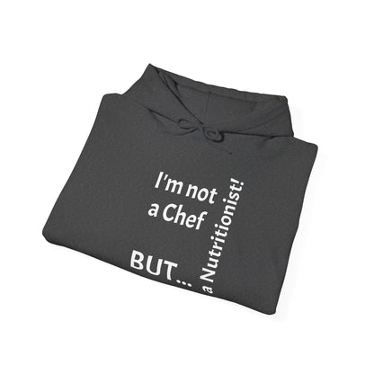 "I'm Not a Chef, But a Nutritionist!"  - Sweatshirt Unissexo Heavy Blend™ com Capuz